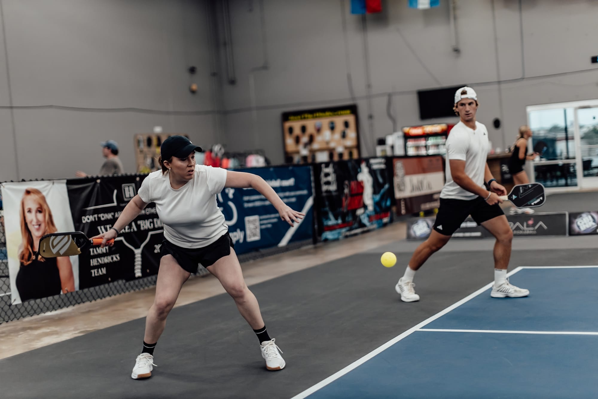 Pickleball player hitting the ball